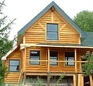 SIP panel cottage with log siding