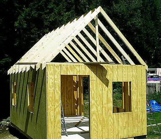 The cabin uses single-wall plywood(T1-11) siding. The roof rafters are 