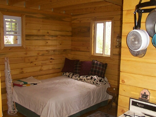 Owner-built 14x24 cabin bedroom